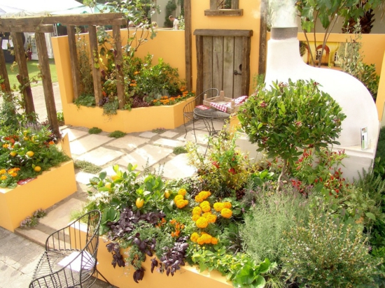 garden pergola made of wood mediterranean plants warm color scheme yellow