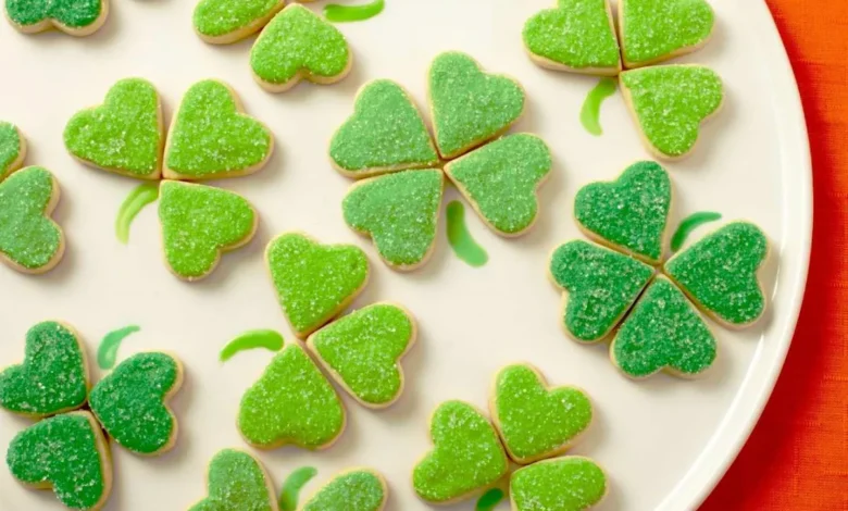 cut out shamrock cookies with green icing