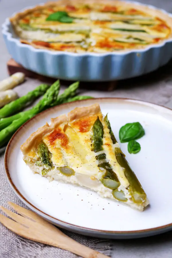 A piece of asparagus quiche on the plate