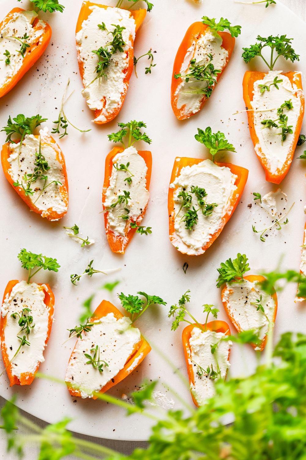 Easter finger food filled peppers Mini peppers filled with cream cheese (as carrots).