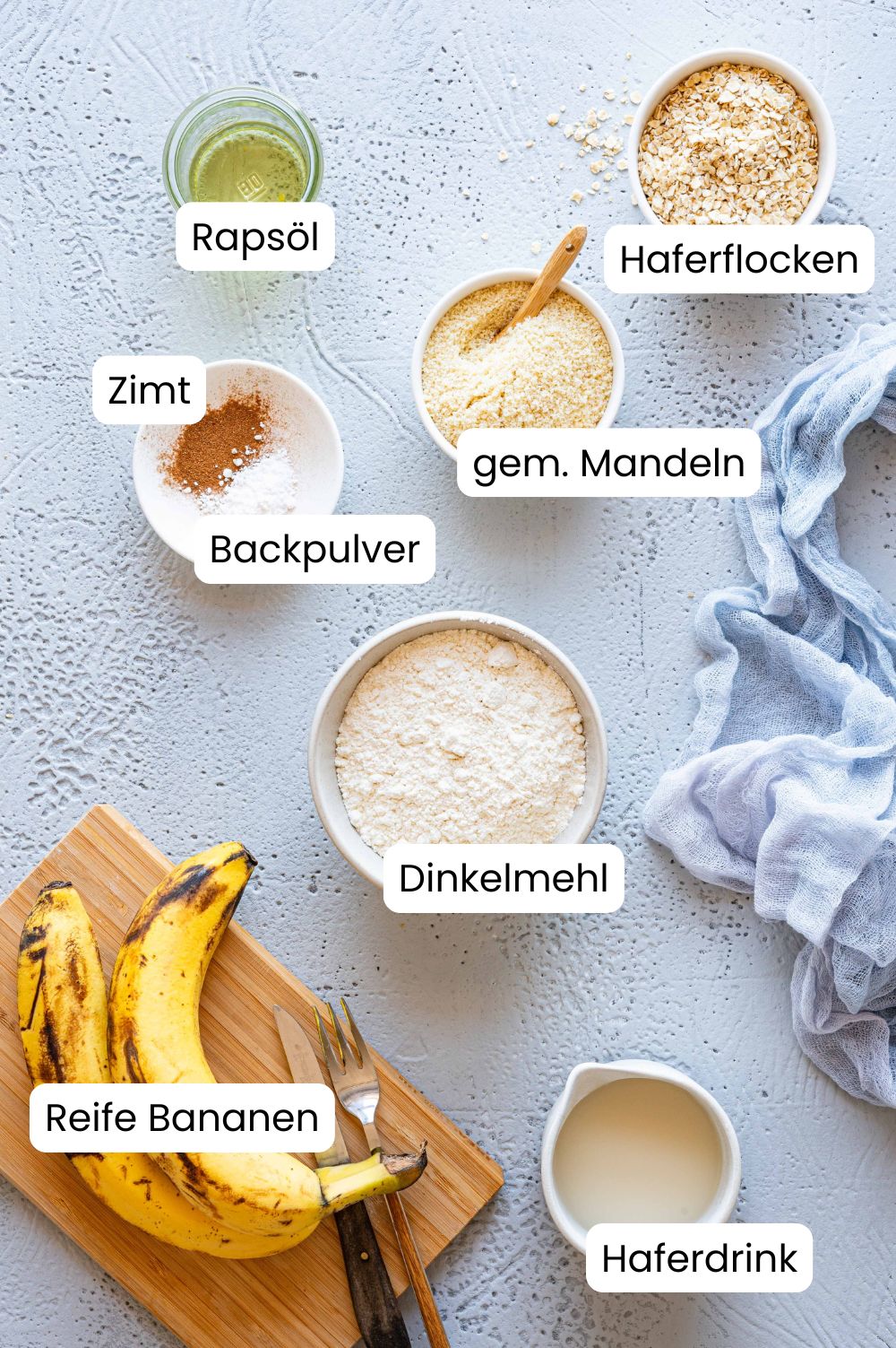 Ingredients for the banana bread without egg in bowls photographed from above and labeled as a graphic.