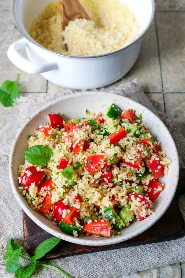 Couscous prepared as a salad in a deep plate.