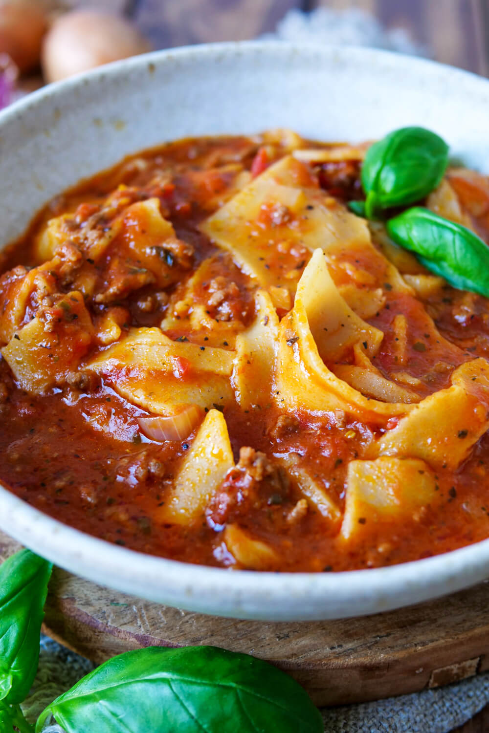 Lasagnial soup with basil in the bowl