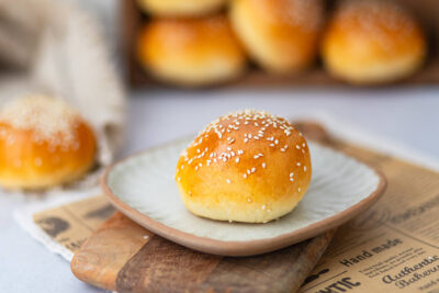 Hamburger buns on the wooden board