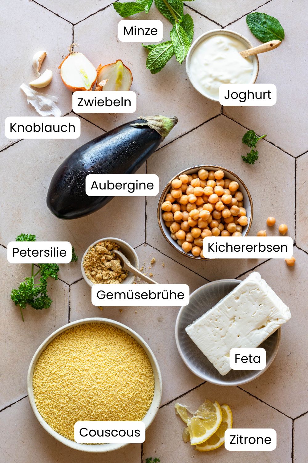 Couscous aubergine pan ingredients labeled Ingredients for the couscous aubergine pan photographed from above and labeled as a graphic.