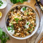 Couscous-Auberginen pan with chickpeas, feta and yogurt mint dip.