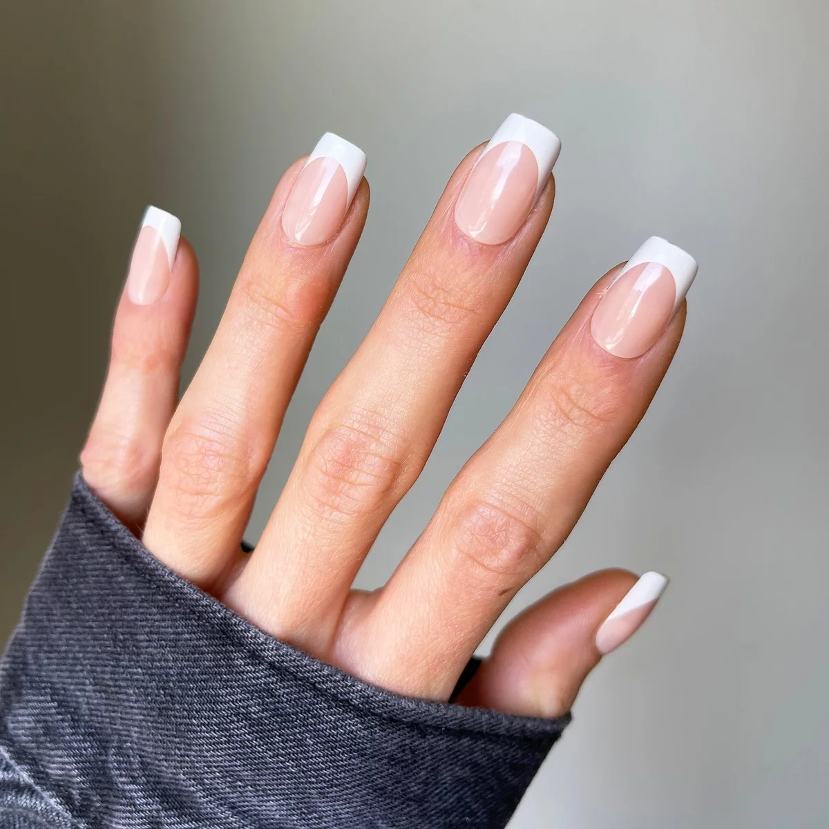 Classic French nail design - pink paint with pearl white on the tips 