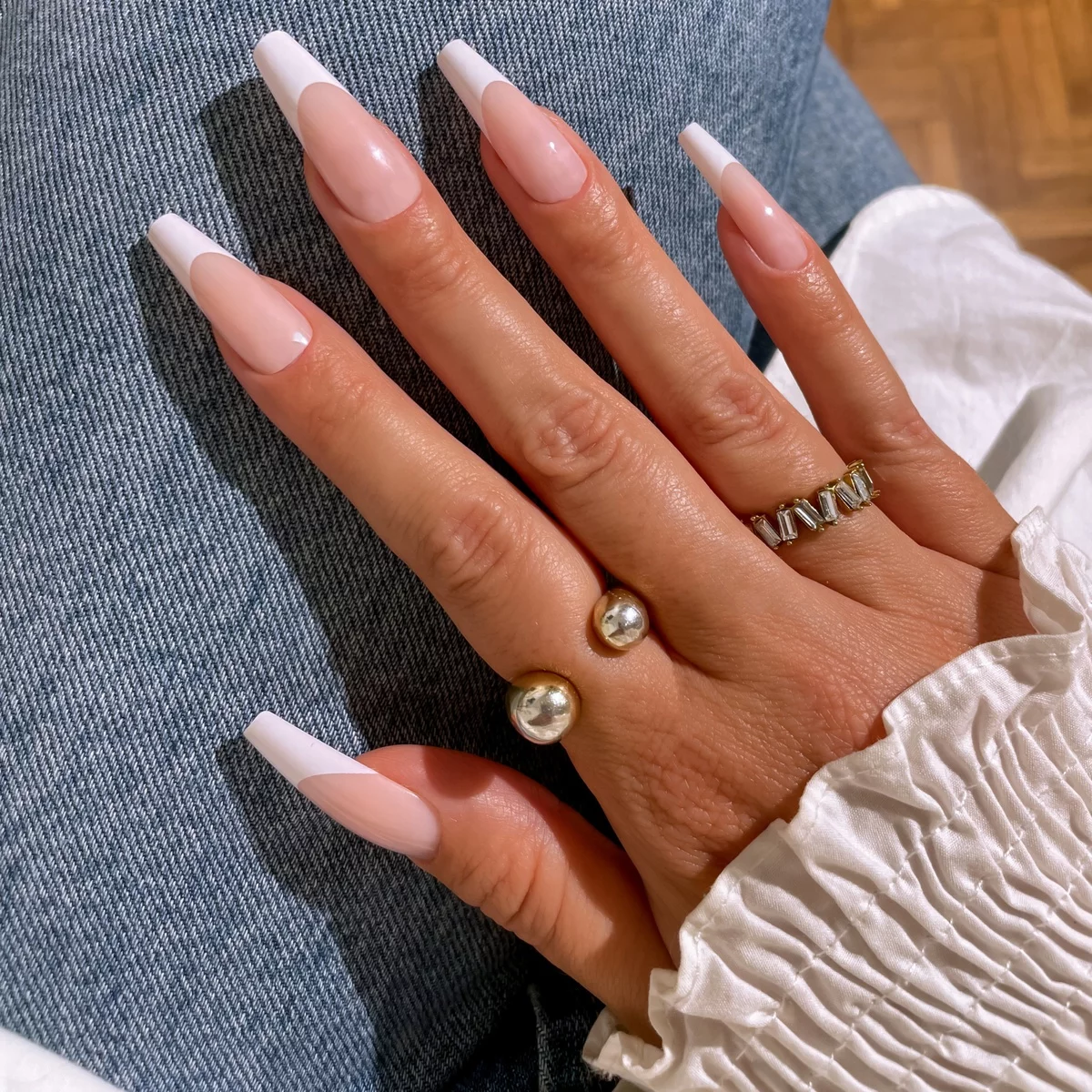 long nails styled in pink and pearl white