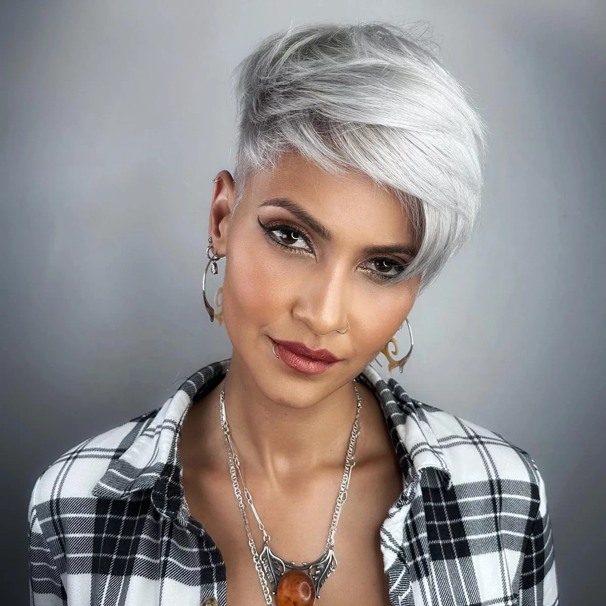 Gray hair styled in asymmetrical pixie 