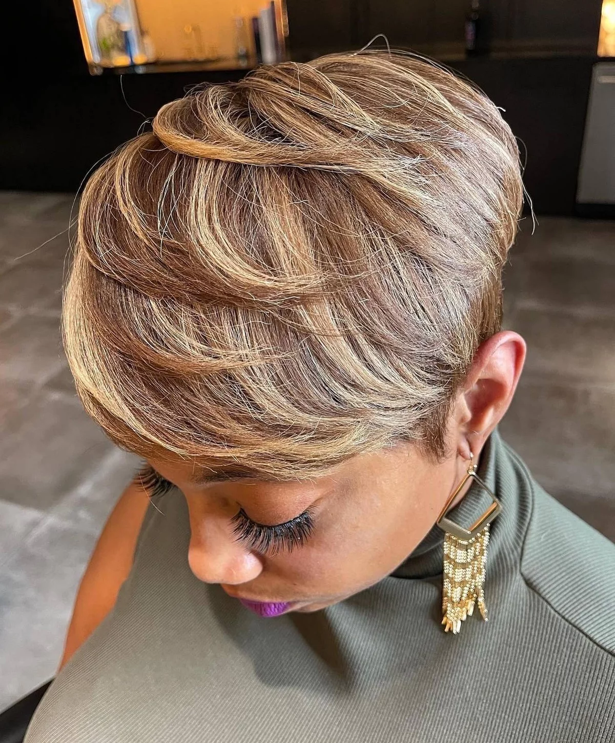 Young woman with light hair has Pixie cut 