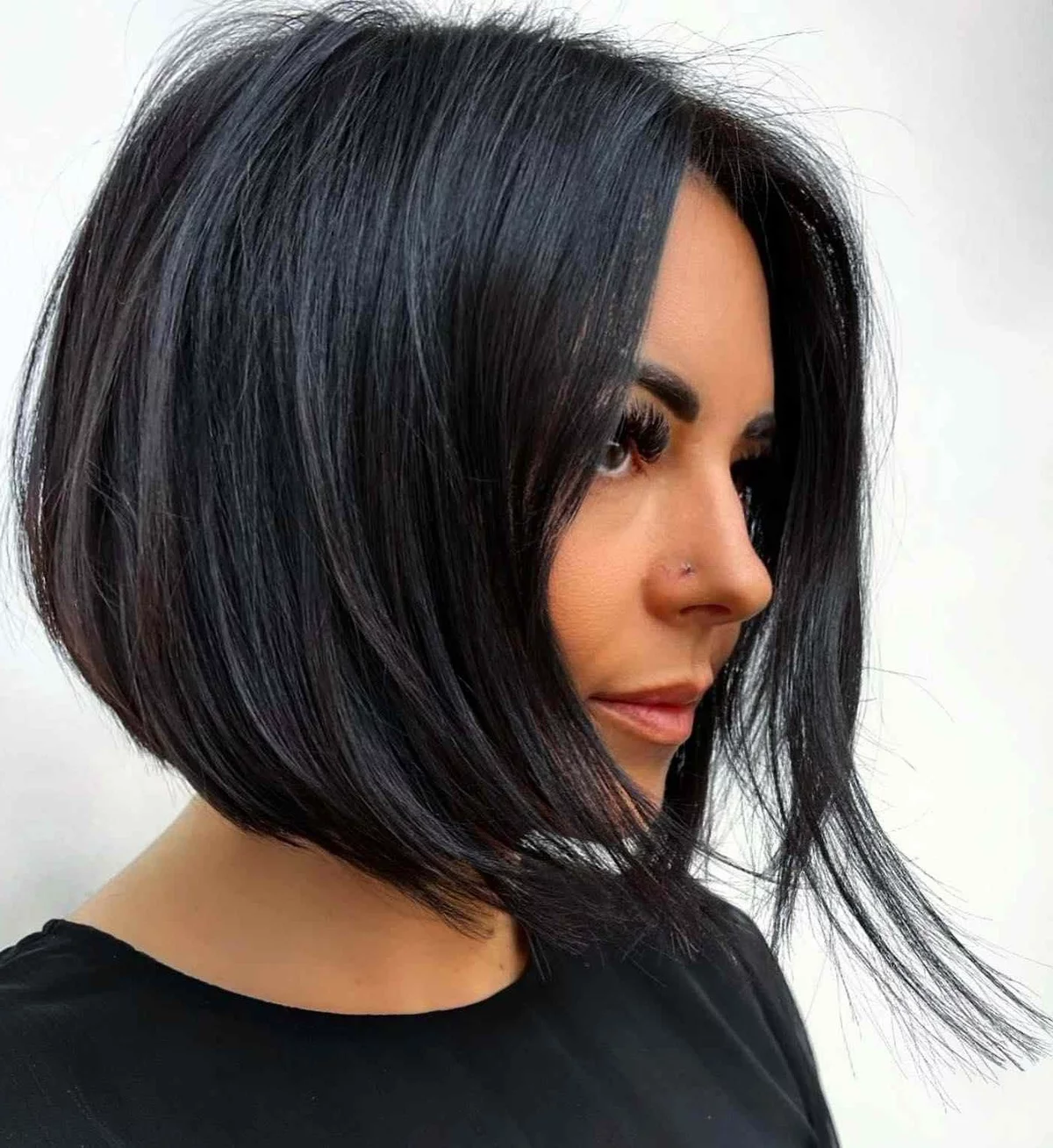 Young woman styled dark hair in bob hairstyle