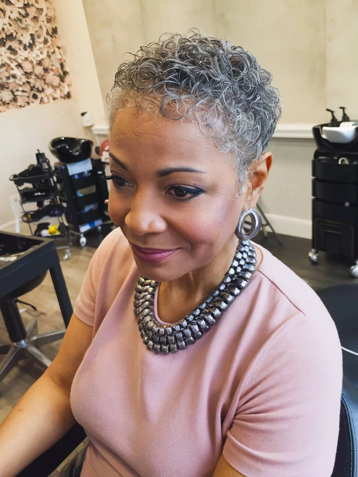 Woman with gray hair at the hairdresser