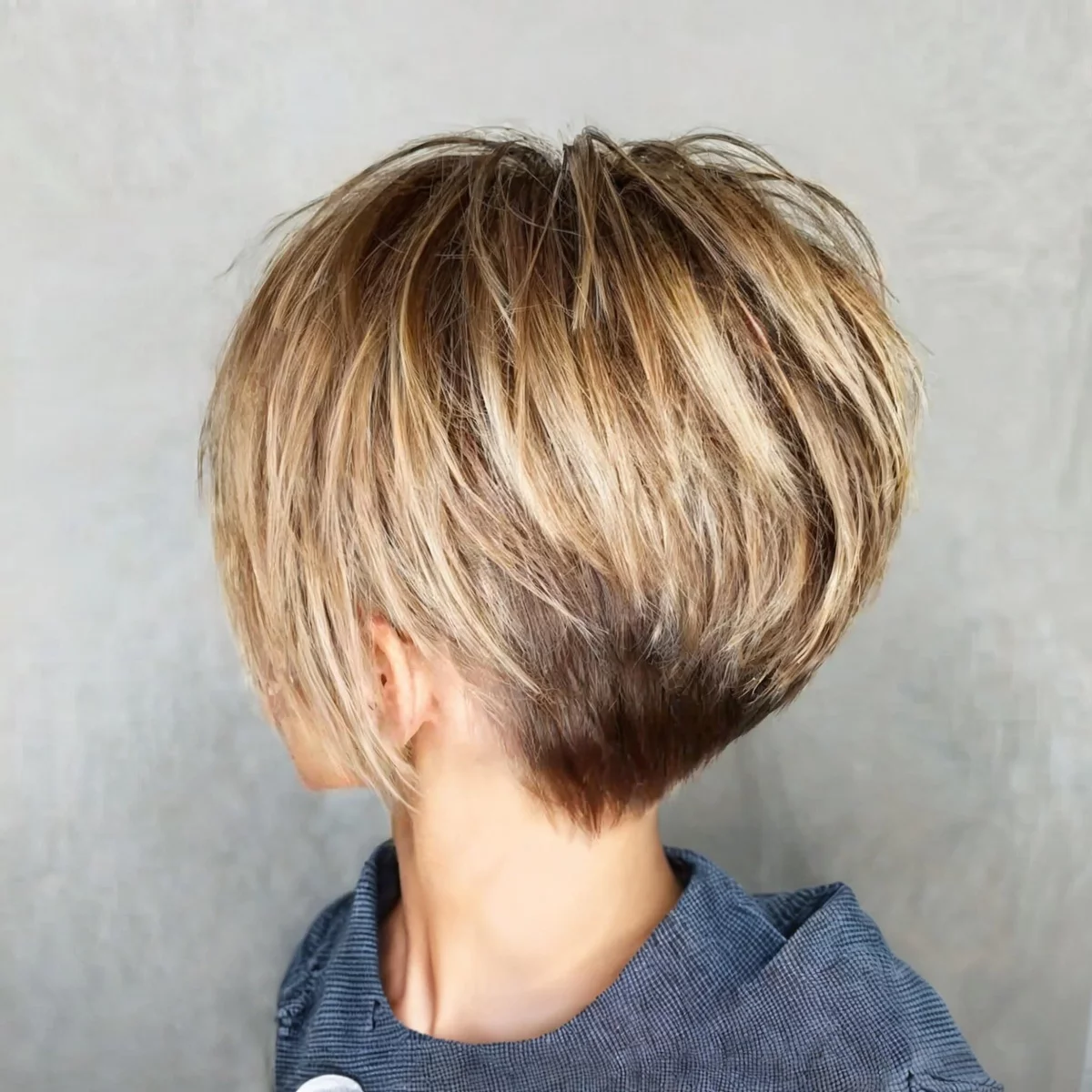 Young woman with a well -styled pixie 