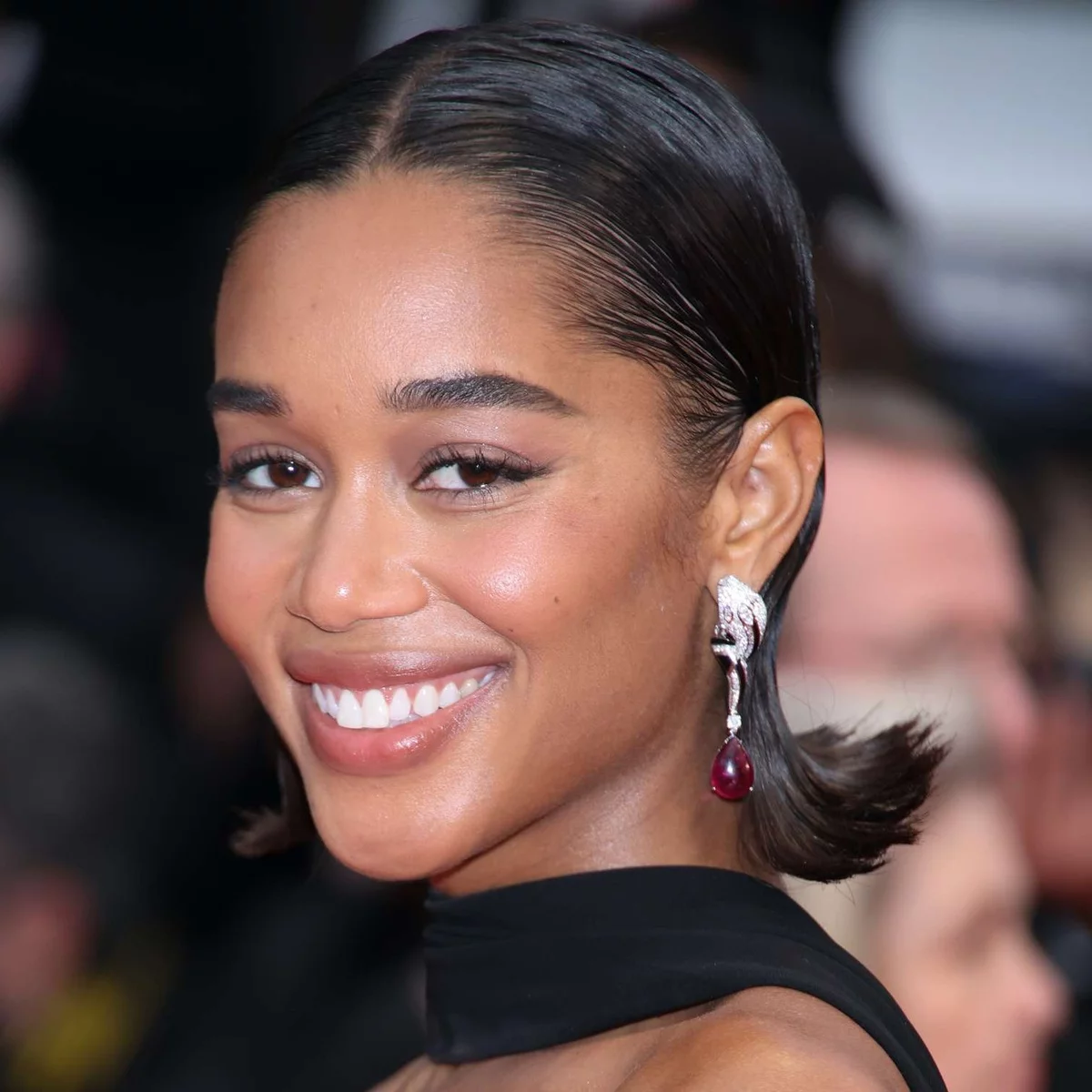 Young woman wears Bob but styled with a lot of hairspray