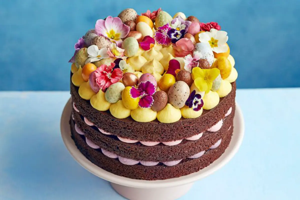 Three layers of chocolate cake with fresh decoration on it
