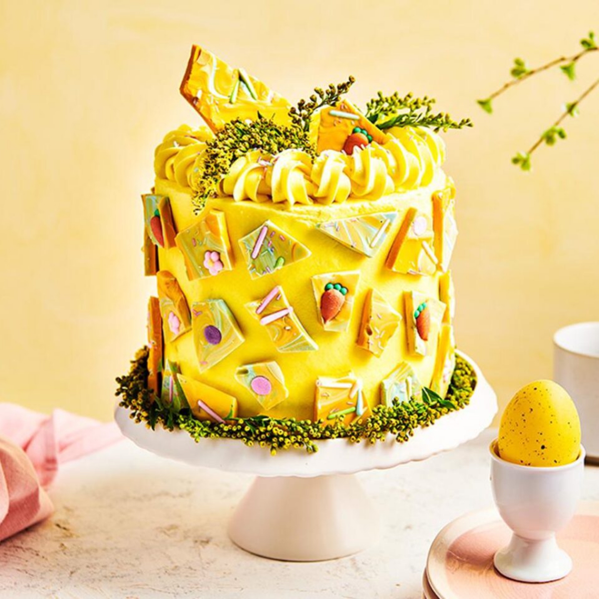 Easter cake in yellow and splendidly decorated