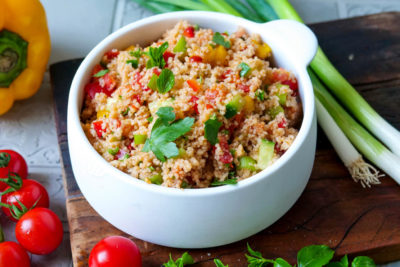 Couscous salad with peppers, spring onions, cucumbers and tomatoes